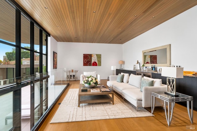 living room featuring recessed lighting, expansive windows, wood ceiling, and wood finished floors