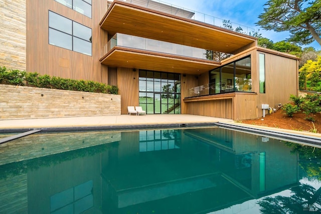 pool with a patio area