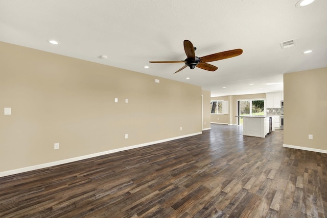9862 Whalen Rd, Wallace, CA 95252 - unfurnished living room with dark wood-style flooring, baseboards, ceiling fan, and recessed lighting