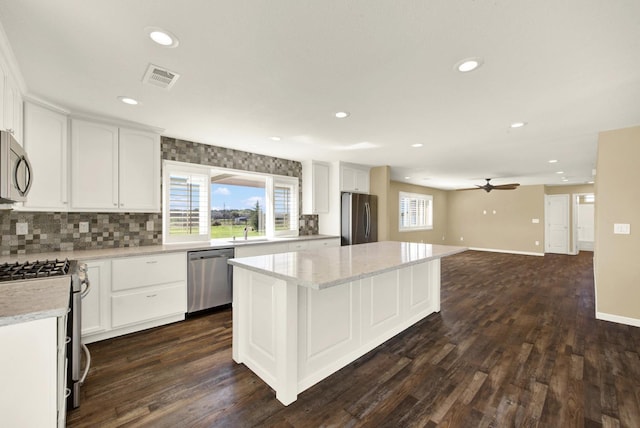 9862 Whalen Rd, Wallace, CA 95252 - kitchen featuring appliances with stainless steel finishes, a center island, ceiling fan, recessed lighting, and white cabinetry