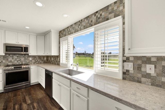 9862 Whalen Rd, Wallace, CA 95252 - kitchen featuring appliances with stainless steel finishes, a sink, white cabinets, light stone countertops, and recessed lighting
