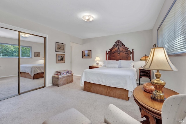 carpeted bedroom with baseboards