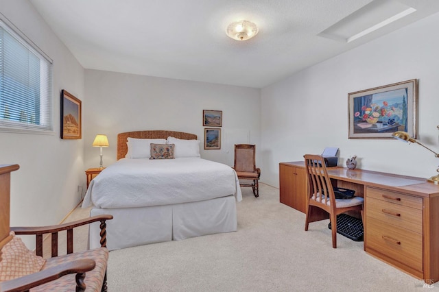 bedroom with light colored carpet