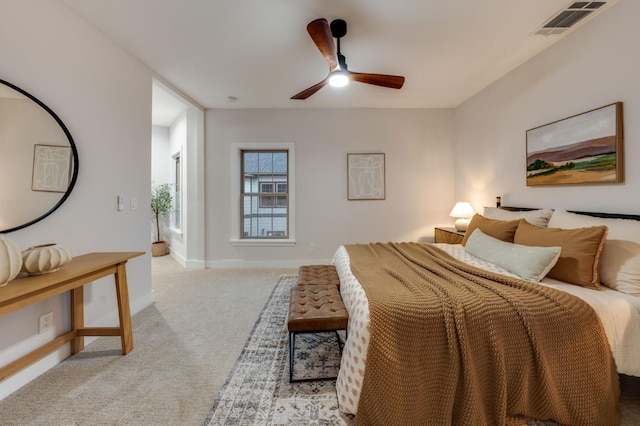 bedroom featuring visible vents, carpet floors, baseboards, and ceiling fan