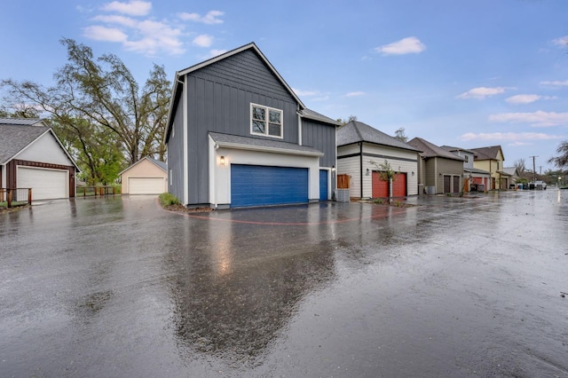 exterior space with board and batten siding and a garage