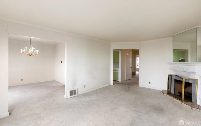 unfurnished living room featuring visible vents, carpet floors, a fireplace with raised hearth, and ornamental molding