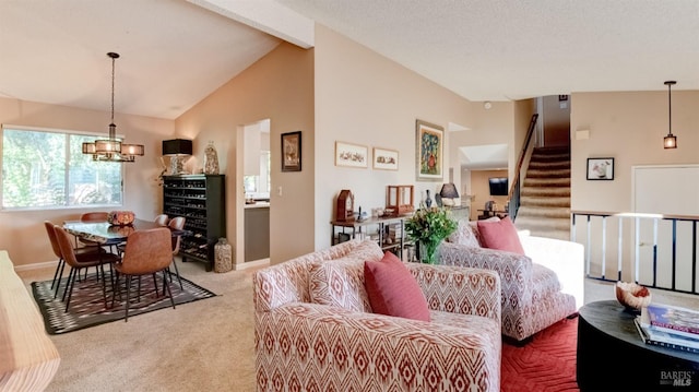 living area with stairway, baseboards, carpet floors, an inviting chandelier, and vaulted ceiling with beams