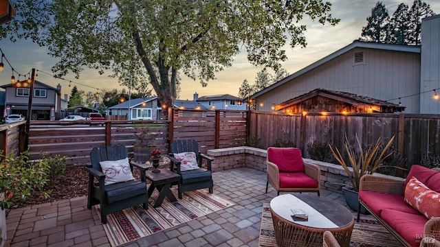 view of patio featuring outdoor lounge area and a fenced backyard