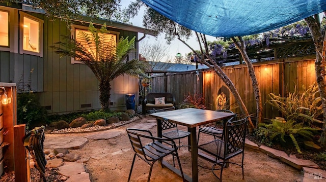 view of patio / terrace featuring outdoor dining area and a fenced backyard