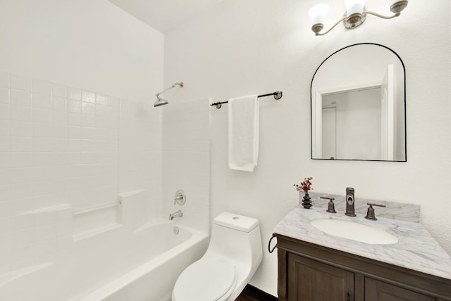 bathroom with toilet, shower / washtub combination, and vanity