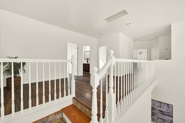 stairs featuring recessed lighting and wood finished floors