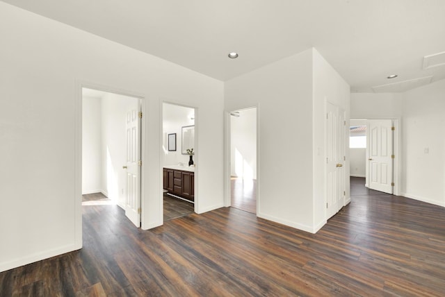 unfurnished room with recessed lighting, baseboards, and dark wood-type flooring