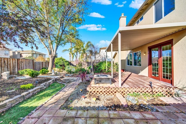 view of yard with a deck and a fenced backyard