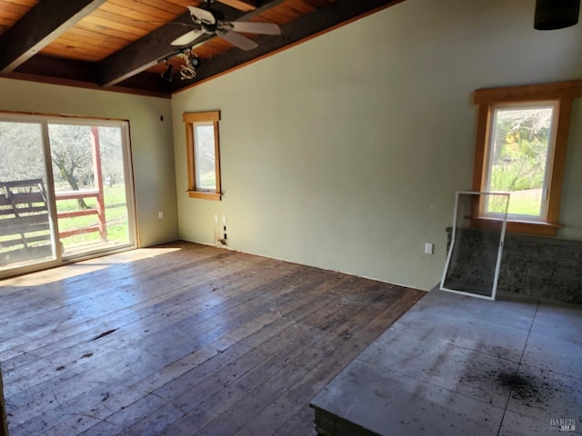 unfurnished room featuring beam ceiling, hardwood / wood-style flooring, a ceiling fan, and wooden ceiling