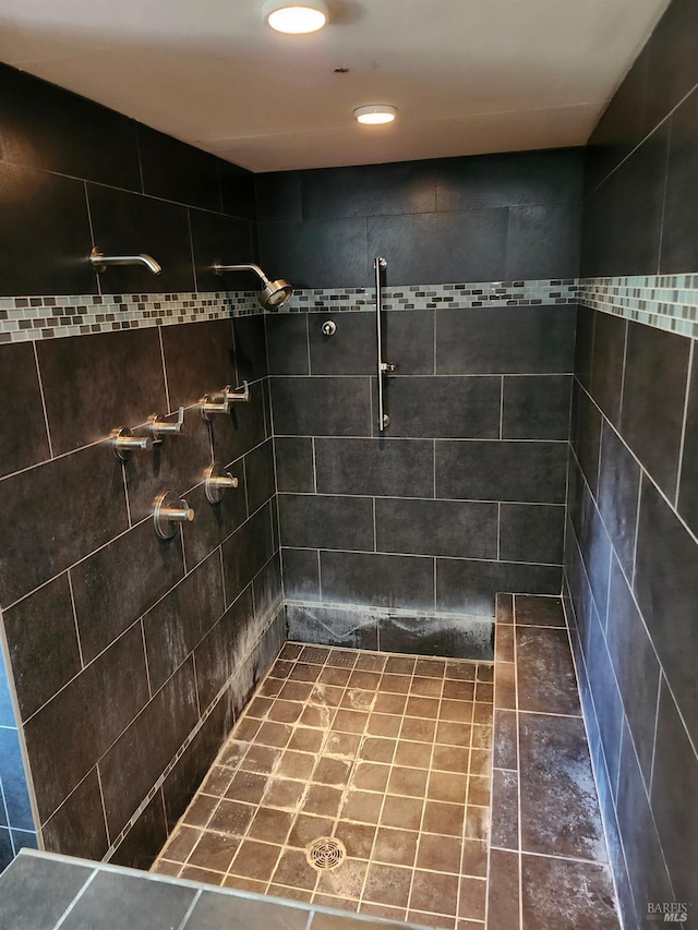 full bathroom with tiled shower