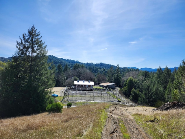 mountain view featuring a forest view