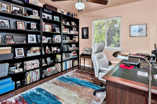 office with baseboards, ceiling fan, and wood finished floors