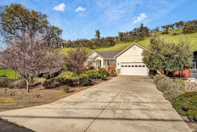 view of front of property with driveway and an attached garage