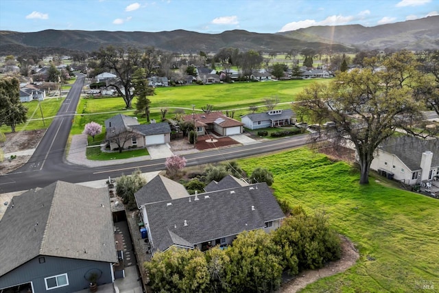 aerial view with a mountain view and a residential view