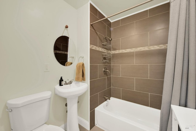 full bath with shower / bath combo with shower curtain and toilet