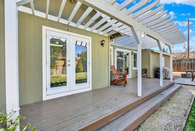 deck with fence, french doors, a pergola, and grilling area