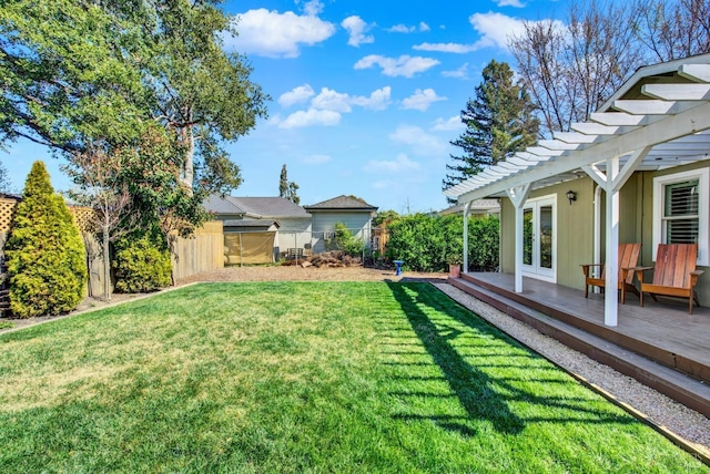 view of yard featuring a deck, fence, french doors, and a pergola