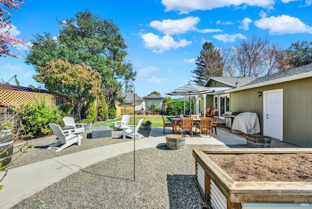 view of patio / terrace featuring area for grilling and fence