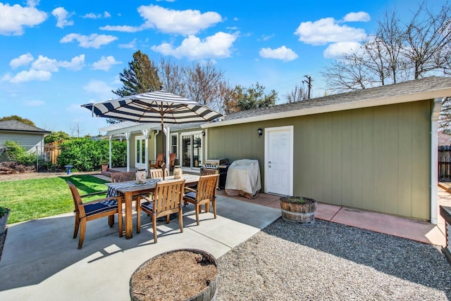 view of patio / terrace with outdoor dining space, grilling area, and fence