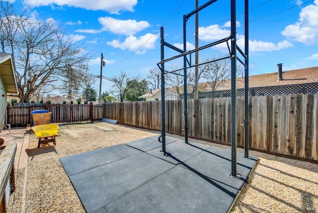 view of sport court with a fenced backyard