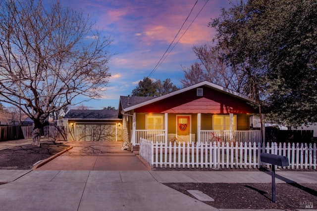 view of front of property with a fenced front yard and covered porch