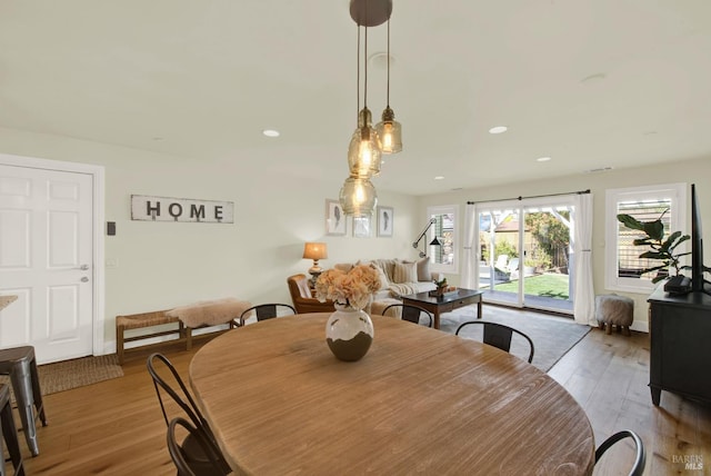 dining space featuring recessed lighting and wood finished floors