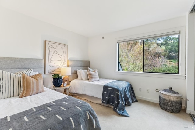 carpeted bedroom with baseboards