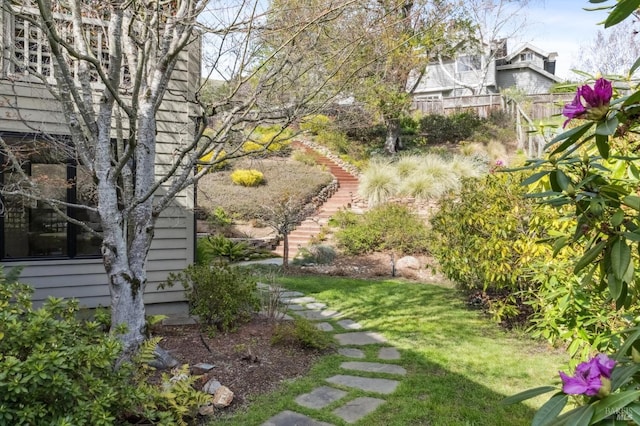 view of yard with stairway and fence