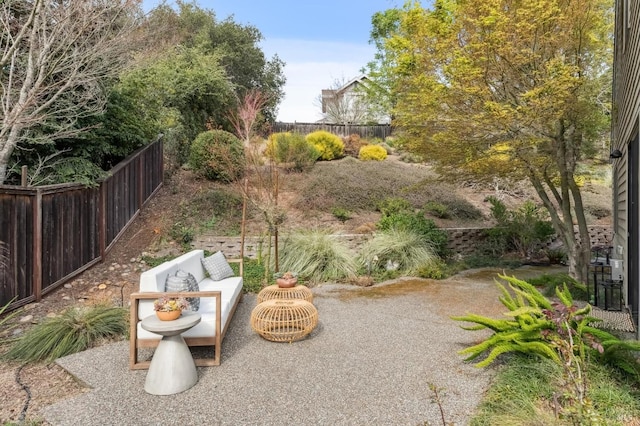 exterior space featuring outdoor lounge area, a patio area, and fence