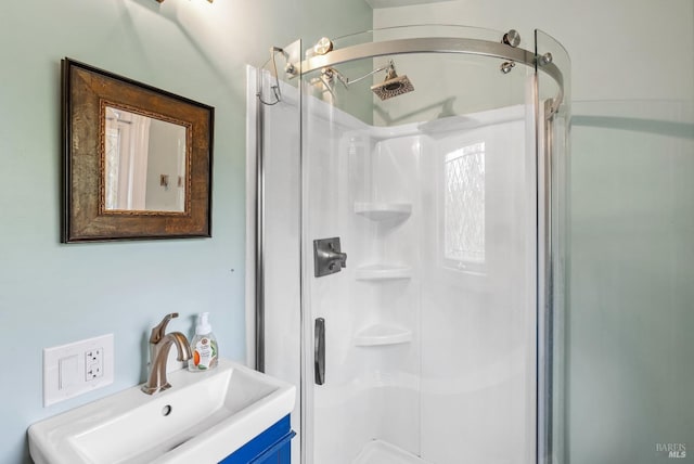 bathroom featuring a stall shower and vanity