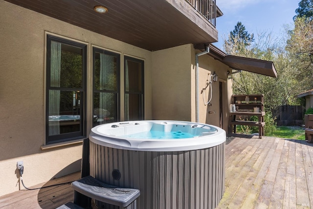 deck with a hot tub