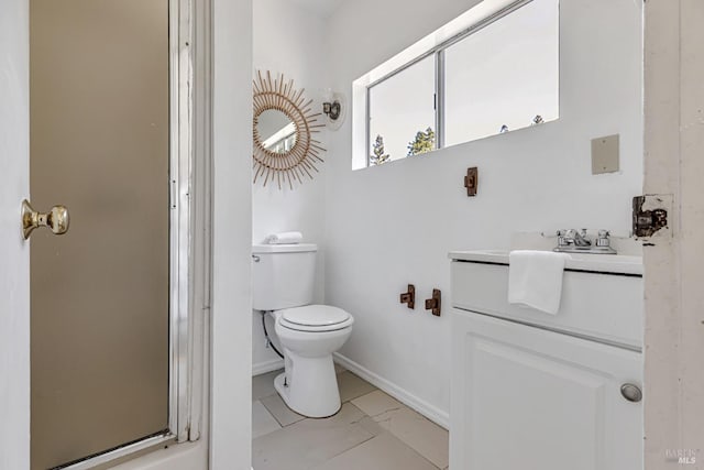bathroom with vanity, marble finish floor, baseboards, and toilet