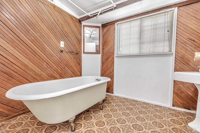 full bathroom with wooden walls, tile patterned floors, and a soaking tub