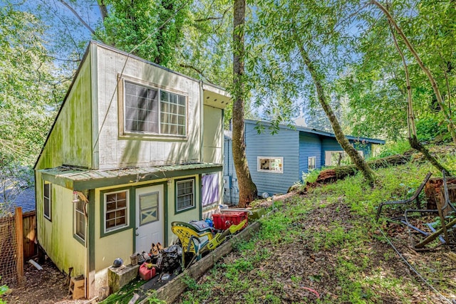 rear view of property with fence