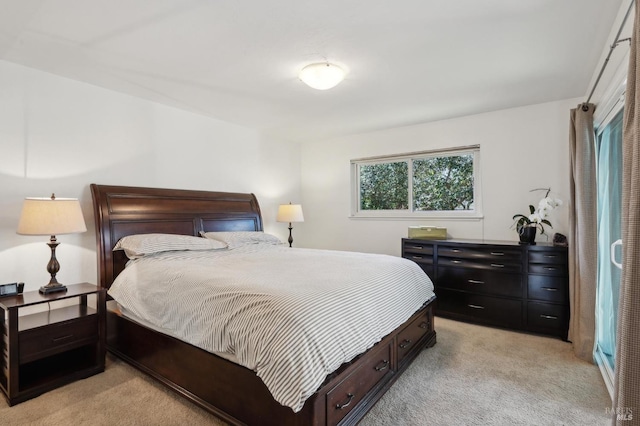 bedroom featuring light carpet