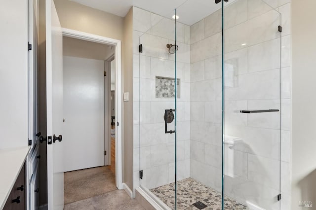 bathroom with a shower stall