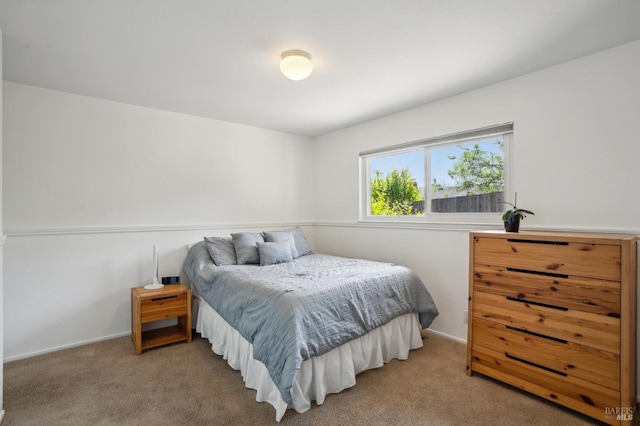 carpeted bedroom with baseboards