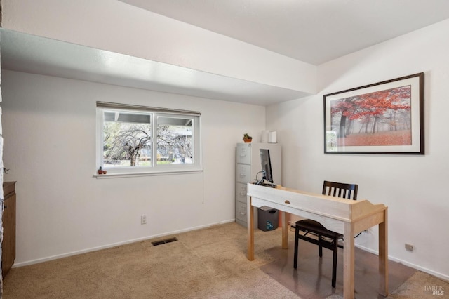 home office featuring visible vents, baseboards, and carpet