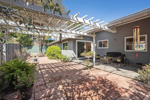 view of patio featuring an outdoor living space, a pergola, and fence