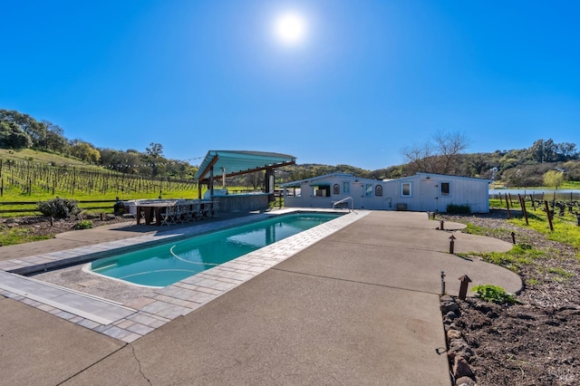 view of swimming pool featuring a fenced in pool, a patio area, and fence