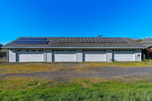 garage featuring solar panels