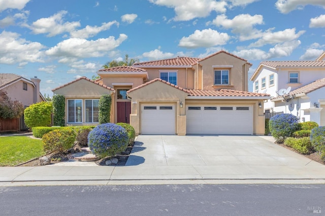 2550 Duncan St, Dixon, CA 95620 - mediterranean / spanish-style house featuring a tile roof, stucco siding, concrete driveway, and an attached garage