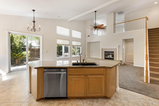 2550 Duncan St, Dixon, CA 95620 - kitchen with dishwasher, a sink, open floor plan, a ceiling fan, and a kitchen island with sink