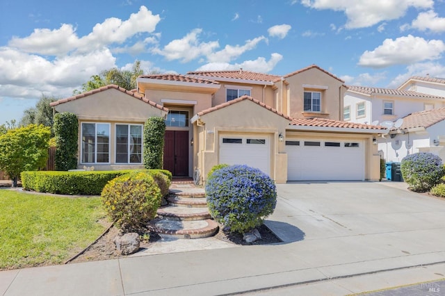 2550 Duncan St, Dixon, CA 95620 - mediterranean / spanish-style house featuring an attached garage, stucco siding, concrete driveway, a tile roof, and a front yard