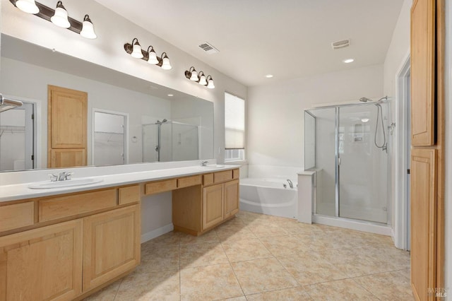 2550 Duncan St, Dixon, CA 95620 - bathroom featuring a shower stall, a walk in closet, a garden tub, double vanity, and recessed lighting